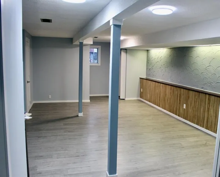 Open living space in the Falconridge Place basement suite